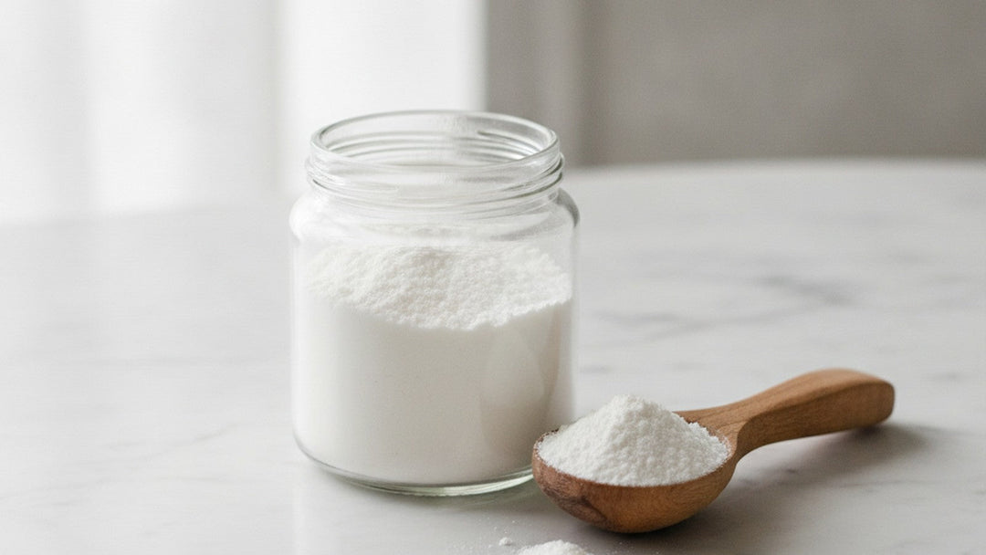 Acacia gum prebiotic powder in glass jar with measuring spoon