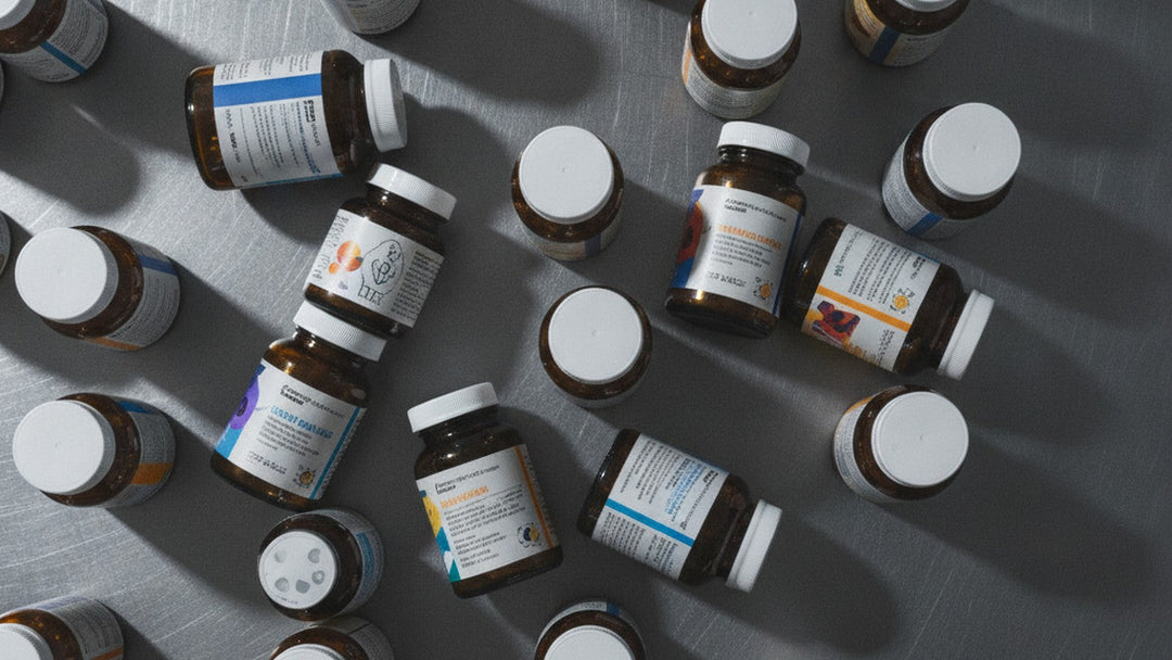 Multiple antioxidant supplement bottles arranged on laboratory bench