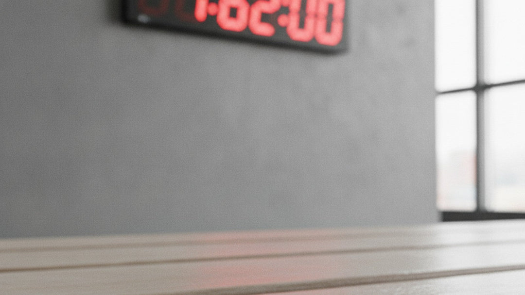 Countdown timer at 62 minutes with supplement capsule on gym bench