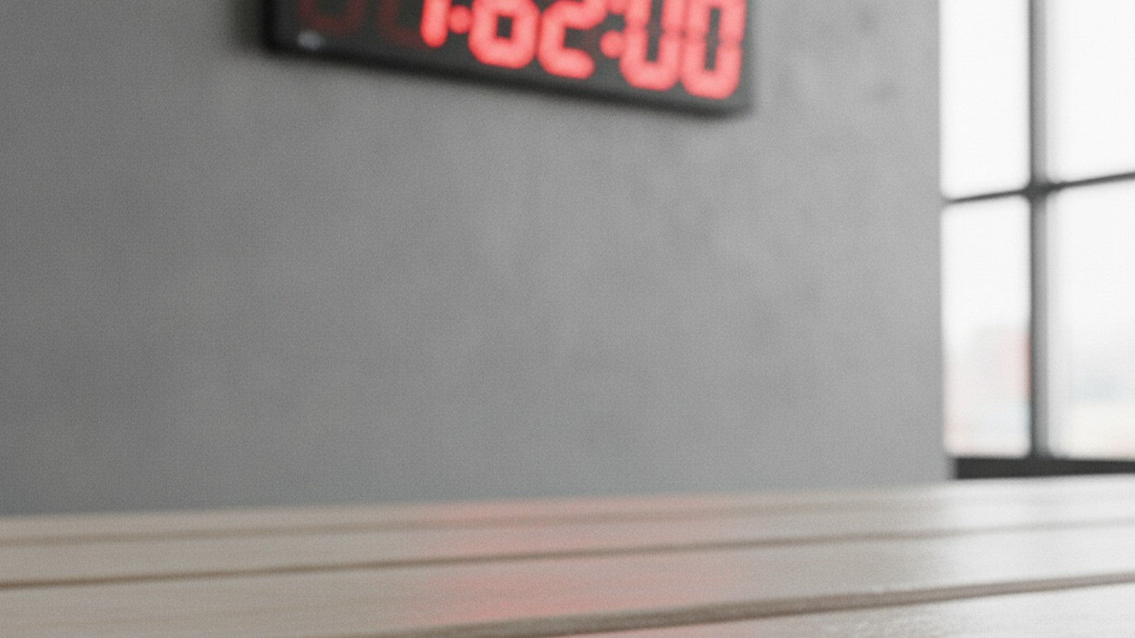 Countdown timer at 62 minutes with supplement capsule on gym bench