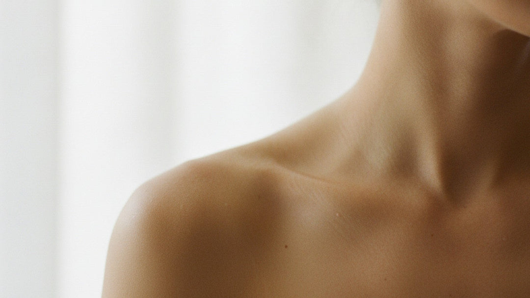 Bare shoulder showing healthy skin texture in natural light