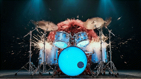 An animated GIF of a chaotic, red monster playing drums wildly. A calm, grey rabbit in a tuxedo appears and conducts, and the monster instantly begins playing a perfect, steady beat, symbolizing heart support.