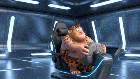  An animated GIF of a prehistoric cartoon man failing at a video game using a stone wheel. A boy genius inserts a green chip into the wheel, and the man instantly becomes an expert player, symbolizing cognitive and mental performance support.